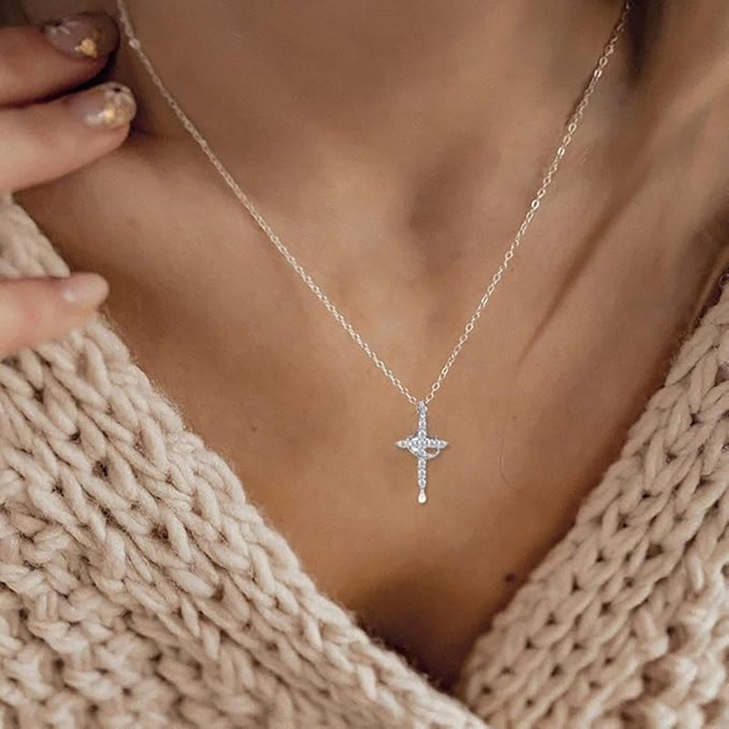 Crown cross necklace with sparkling stones, silver – worn